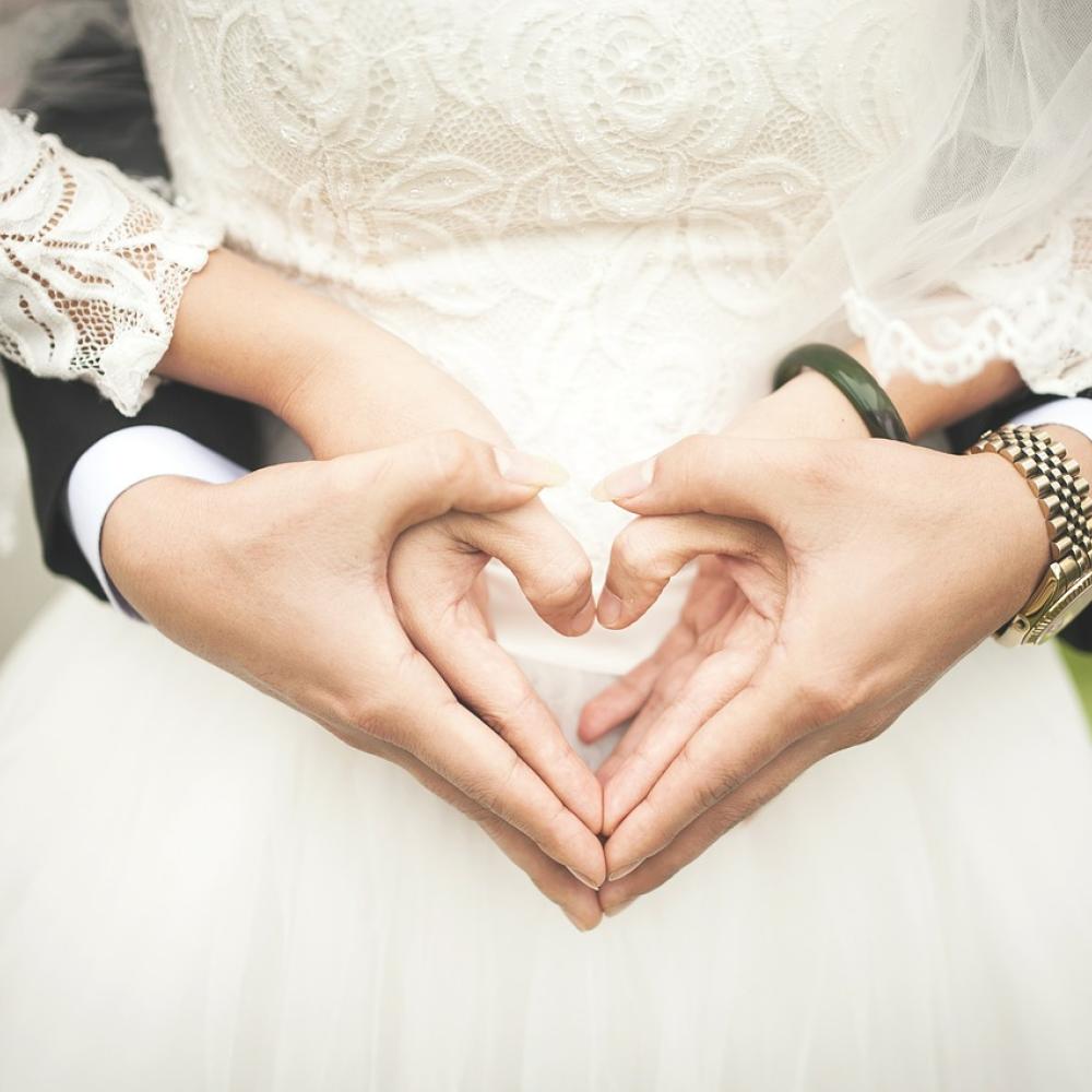 wedding couple with love heart hands